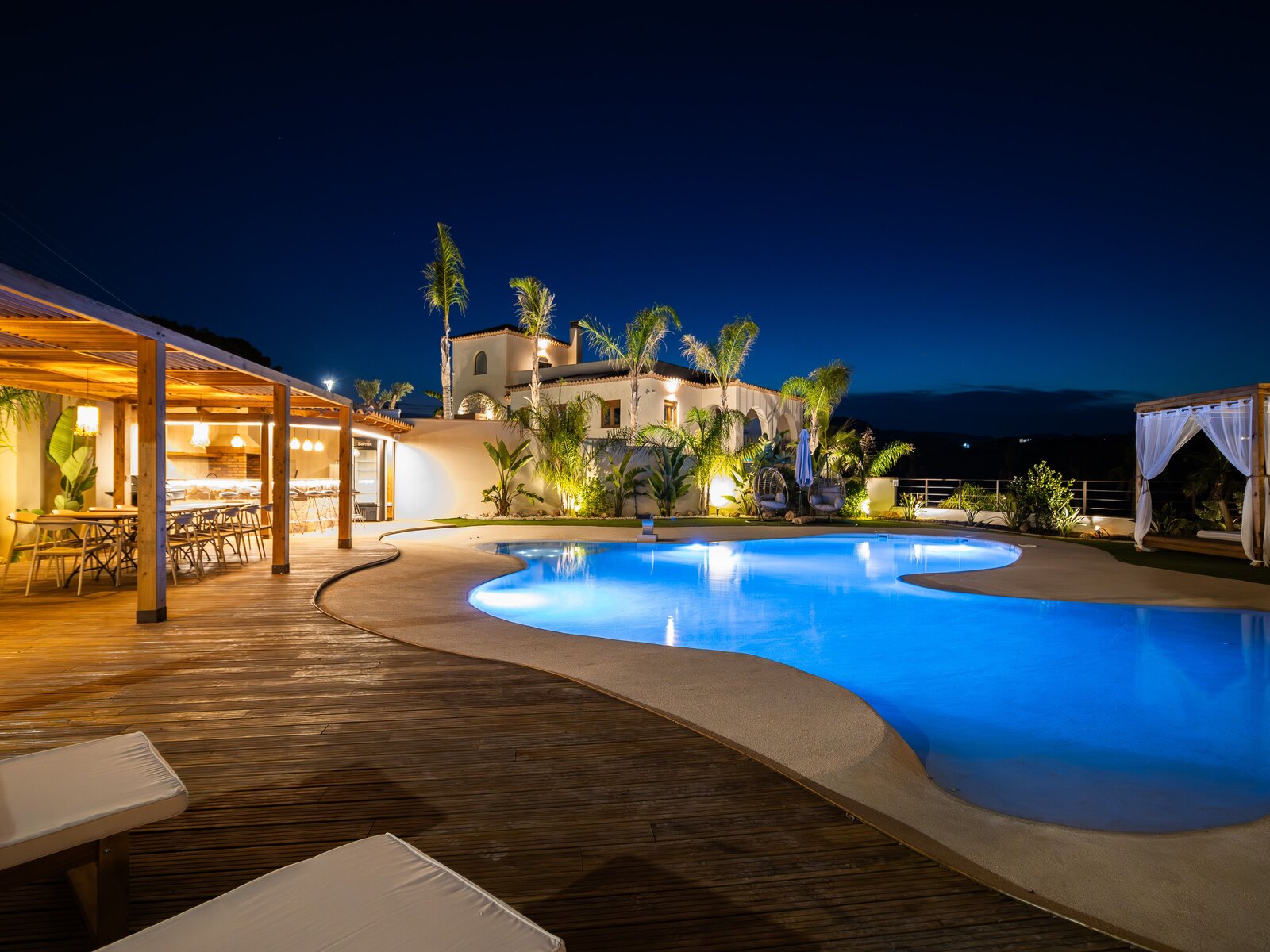 Modern villa with a pool on the Costa del Sol at dusk
